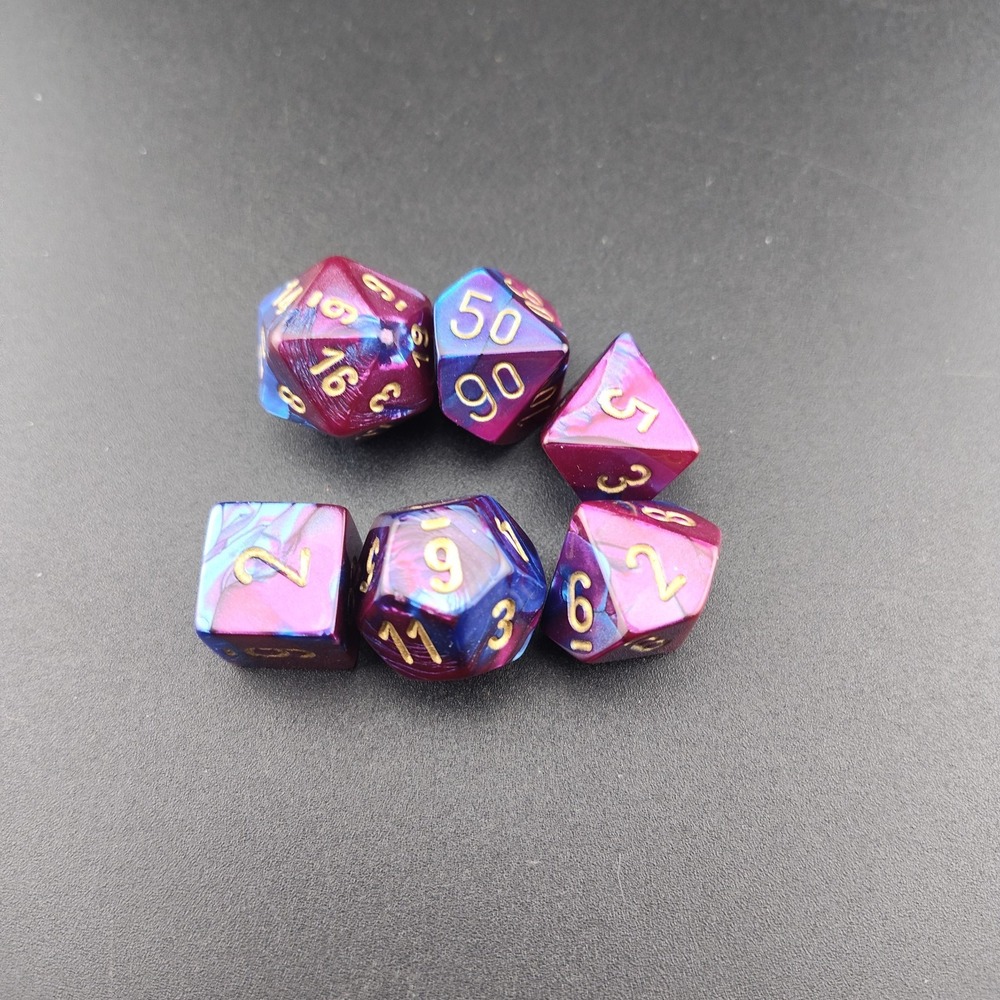 Polyhedral game dice purple blue iridescent gold numbers D&D RPG one missing